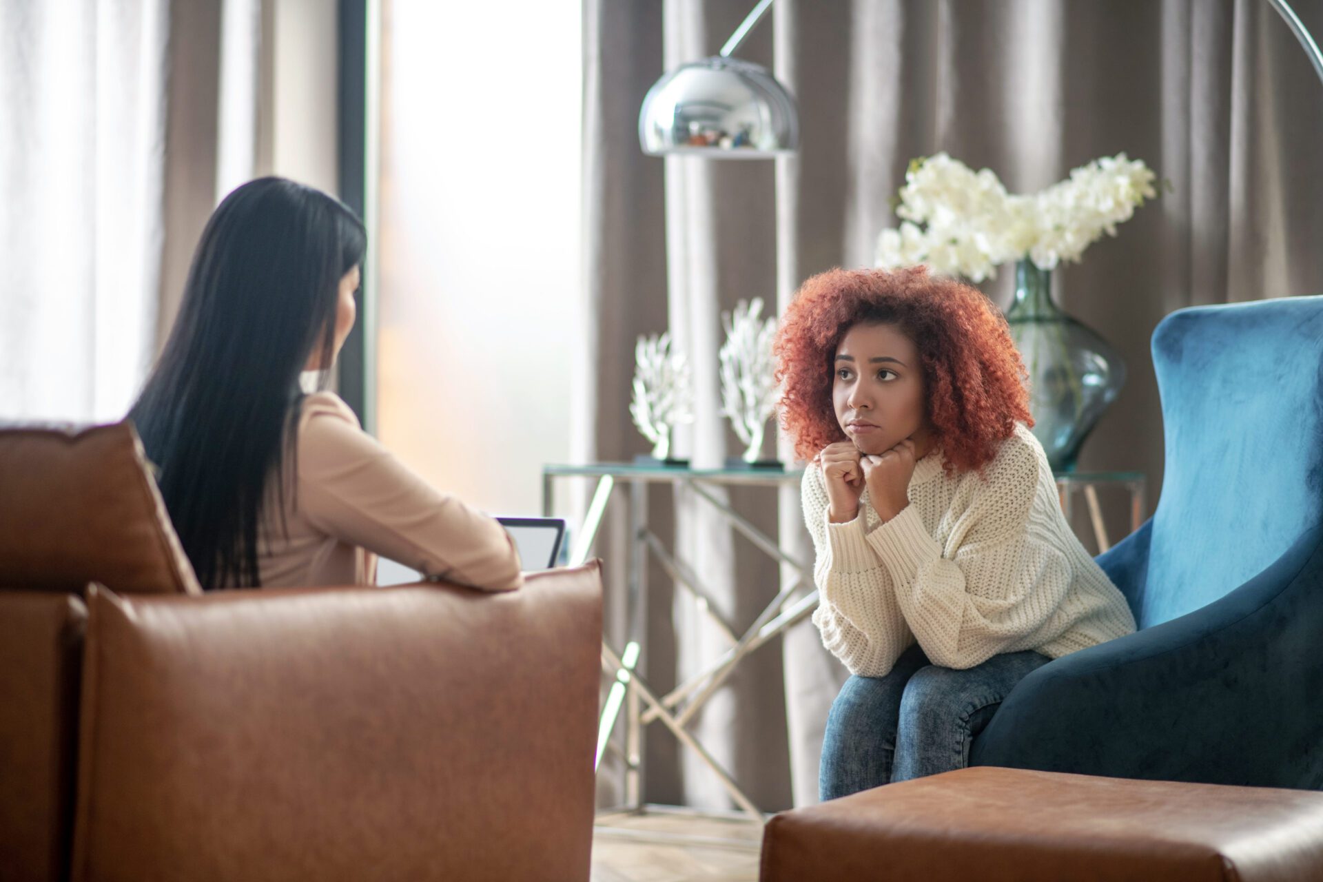 woman receiving supportive mental health therapy in a recovery treatment setting focused on emotional healing