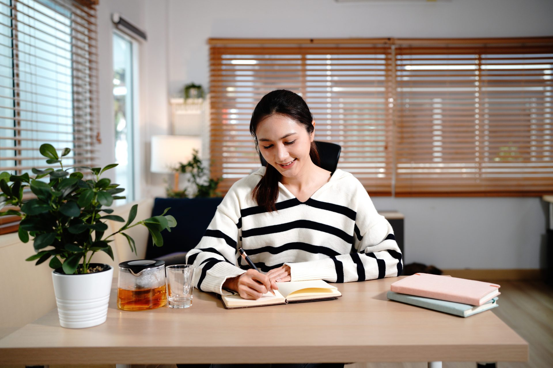 woman journaling her daily routine to support structure and stability in recovery